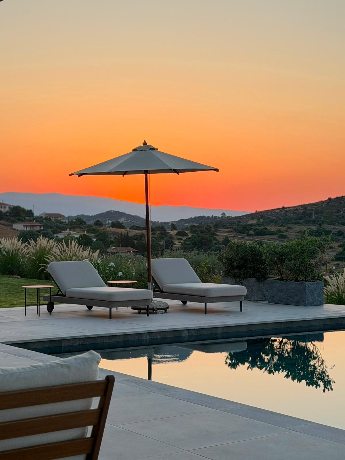 Terrace and pool with sea view at Villa V
