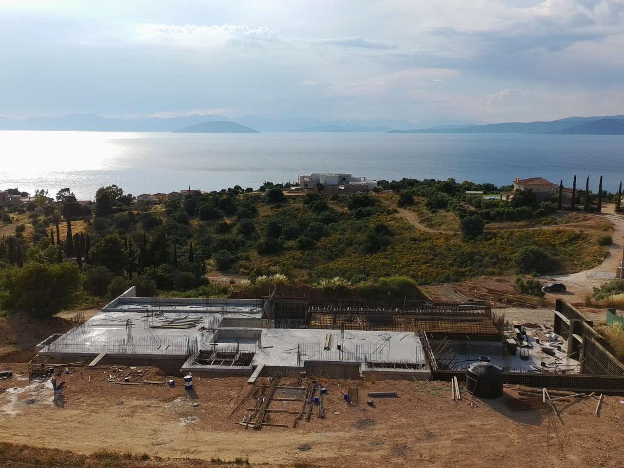 Villa X under construction above the sea in Kilada, Porto Heli